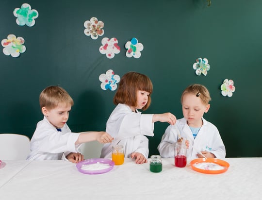 young children performing a science experiment