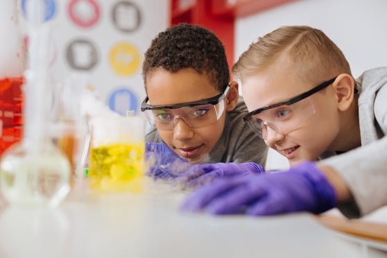 Two boys working together in science lab