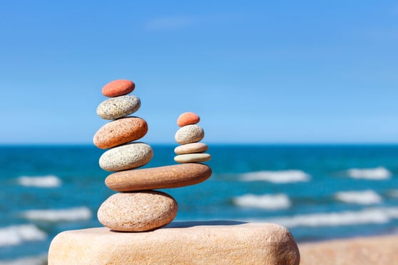 Rocks stacked on top of each other, forming a balance scale. 